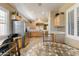 Bright, open kitchen features stainless appliances, light wood cabinets and a breakfast nook at 16857 W Villagio Dr, Surprise, AZ 85387