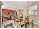 Open living area with tile floors, cozy seating, and direct access to the patio for indoor-outdoor flow at 16857 W Villagio Dr, Surprise, AZ 85387