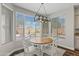 Charming breakfast nook with backyard view and modern lighting fixture at 1694 E Campbell Ave, Gilbert, AZ 85234