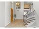 Elegant foyer with high ceilings, staircase, and a stylish front door at 1694 E Campbell Ave, Gilbert, AZ 85234