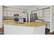 Spacious kitchen featuring granite countertops, island with sink, and stainless steel appliances at 1694 E Campbell Ave, Gilbert, AZ 85234