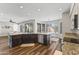 Open kitchen boasts a large island, stainless steel appliances, and breakfast nook at 1694 E Campbell Ave, Gilbert, AZ 85234