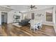 Inviting living room features wood floors, fireplace, and ample seating at 1694 E Campbell Ave, Gilbert, AZ 85234