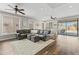 Spacious living room boasts a large sectional sofa and sliding glass doors to the backyard at 1694 E Campbell Ave, Gilbert, AZ 85234