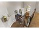Elegant staircase with wrought iron railing and natural light from above at 1694 E Campbell Ave, Gilbert, AZ 85234
