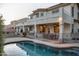 Large two-story home with backyard pool, patio, and outdoor dining area are perfect for entertaining and relaxation at 1707 E Carob Dr, Chandler, AZ 85286