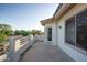 Balcony with beautiful street and landscape views, plus white columns and railing at 1707 E Carob Dr, Chandler, AZ 85286