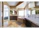 Large bathroom featuring a soaking tub, a vanity with cabinets, and neutral tile flooring at 1707 E Carob Dr, Chandler, AZ 85286