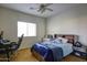 Bedroom with carpet, a ceiling fan, a window, and desk at 1707 E Carob Dr, Chandler, AZ 85286
