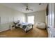 Bedroom featuring a ceiling fan, bed, and a door to outside at 1707 E Carob Dr, Chandler, AZ 85286