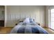 Bedroom featuring a bed, wall molding, and sliding glass doors to outside at 1707 E Carob Dr, Chandler, AZ 85286