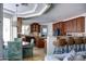 Open-concept dining area with a kitchen view, plush seating, and counter seating at 1707 E Carob Dr, Chandler, AZ 85286