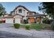 Attractive exterior of home with lights highlighting the front entrance at 1707 E Carob Dr, Chandler, AZ 85286