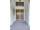 Elegant front door featuring glass panels and a transom window, creating an inviting entrance at 1707 E Carob Dr, Chandler, AZ 85286