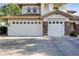 A spacious three-car garage with stone pillar accents at 1707 E Carob Dr, Chandler, AZ 85286