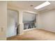 Second floor hallway features carpet flooring, an arched doorway, and a skylight for extra natural lighting at 1707 E Carob Dr, Chandler, AZ 85286