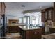 Open-concept floor plan features living room and kitchen with granite countertops at 1707 E Carob Dr, Chandler, AZ 85286