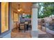 Covered patio featuring ceiling fans and outdoor seating, overlooking the pool area at 1707 E Carob Dr, Chandler, AZ 85286