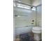 Modern bathroom shower with glass doors, hand held sprayer, and tile surround at 1707 E Carob Dr, Chandler, AZ 85286