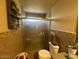 Full bathroom featuring shower with glass door, toilet and simple decor at 1841 S Spruce --, Mesa, AZ 85210