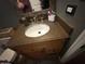 Bathroom featuring granite countertops, vanity, wood cabinets and neutral color palette at 1841 S Spruce --, Mesa, AZ 85210