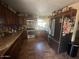 Kitchen featuring dark wood cabinets, granite countertops, and stainless-steel appliances at 1841 S Spruce --, Mesa, AZ 85210