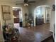Open living room with tile flooring, ceiling fan, and views into the kitchen and dining areas at 1841 S Spruce --, Mesa, AZ 85210