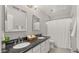 Elegant bathroom with double vanity, granite countertops and tiled floors at 18518 E Ashridge Dr, Queen Creek, AZ 85142