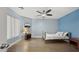 Bright bedroom featuring wood floors and a window offering pleasant views at 18518 E Ashridge Dr, Queen Creek, AZ 85142