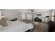 Spacious bedroom with a desk area, bed, and a TV, perfect for work or relaxation at 18518 E Ashridge Dr, Queen Creek, AZ 85142