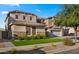 Well-kept two-story house with a lush lawn and attached three-car garage at 18518 E Ashridge Dr, Queen Creek, AZ 85142