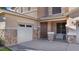 Front exterior of a two-story home featuring stone accents and a three-car garage at 18518 E Ashridge Dr, Queen Creek, AZ 85142