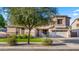 Attractive two-story home with a neatly landscaped yard and a convenient two-car garage at 18518 E Ashridge Dr, Queen Creek, AZ 85142