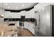 Stylish kitchen featuring white cabinets, stainless steel appliances, a kitchen island and modern countertops at 18518 E Ashridge Dr, Queen Creek, AZ 85142