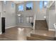 Spacious living room with high ceilings, large windows, and beautiful hardwood floors at 18518 E Ashridge Dr, Queen Creek, AZ 85142