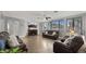 Cozy living room with hardwood floors, modern furniture, and a fireplace providing a warm and inviting atmosphere at 18518 E Ashridge Dr, Queen Creek, AZ 85142