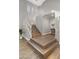 Bright foyer featuring an elegant staircase with white railings and light wood steps, complemented by neutral walls and flooring at 18518 E Ashridge Dr, Queen Creek, AZ 85142