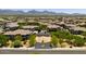 Gorgeous aerial view of the neighborhood surrounded by desert landscape and distant mountains at 20121 N 76Th St # 2058, Scottsdale, AZ 85255
