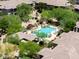 Stunning aerial view of the community pool surrounded by lush landscaping and residential buildings at 20121 N 76Th St # 2058, Scottsdale, AZ 85255