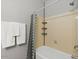 Bathroom featuring a shower tub and mounted towel rack at 20121 N 76Th St # 2058, Scottsdale, AZ 85255