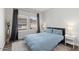 Bright bedroom with light blue duvet, two windows, and neutral walls at 20121 N 76Th St # 2058, Scottsdale, AZ 85255