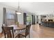 Cozy dining area with hardwood floors, comfortable seating, and ample natural light through large windows at 20121 N 76Th St # 2058, Scottsdale, AZ 85255