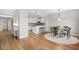 Cozy dining area featuring hardwood floors next to a open-concept kitchen at 20121 N 76Th St # 2058, Scottsdale, AZ 85255