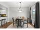 Inviting dining room with a round table, chandelier, and large window with natural light at 20121 N 76Th St # 2058, Scottsdale, AZ 85255