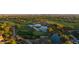 An aerial shot captures a beautiful golf course with serene water features surrounded by native desert vegetation at 20121 N 76Th St # 2058, Scottsdale, AZ 85255