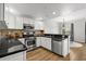 Modern kitchen with stainless steel appliances and black countertops at 20121 N 76Th St # 2058, Scottsdale, AZ 85255