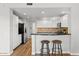 Open-concept kitchen with stainless appliances and breakfast bar with stools at 20121 N 76Th St # 2058, Scottsdale, AZ 85255