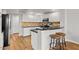 Modern kitchen with white cabinets, stainless steel appliances, and a breakfast bar with seating at 20121 N 76Th St # 2058, Scottsdale, AZ 85255
