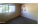 Bedroom with a window and neutral wall color at 2020 W Union Hills Dr # 240, Phoenix, AZ 85027