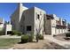 Home exterior featuring well-kept landscaping, neutral tones, and private garage entrances at 2020 W Union Hills Dr # 240, Phoenix, AZ 85027